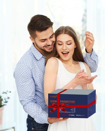 Two people with gift moment, one holding large blue and red wrapped present box with ribbon.