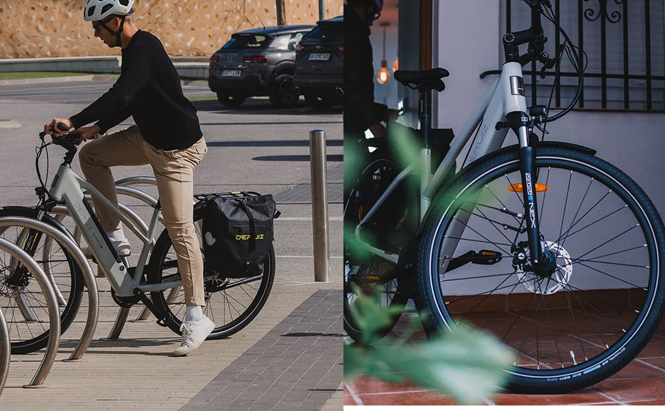 Urbane Radszene, in der das Fahrrad am Fahrradständer gesichert ist, wobei der Schwerpunkt auf dem grünen Fahrradrahmen und dem Scheibenbremssystem liegt, die in der Detailaufnahme sichtbar sind.