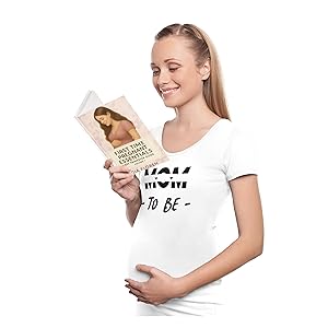 Mom-to-be reading “First Time Pregnant Essentials” while holding her belly.