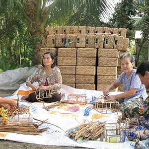 Vietnamese artisans weaving water hyacinth