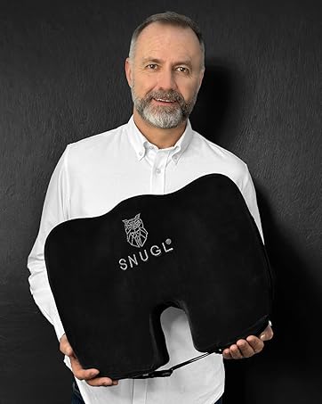 Black ergonomic seat cushion with 'SNUGZ' branding, designed with a U-shaped cutout for comfort and support.