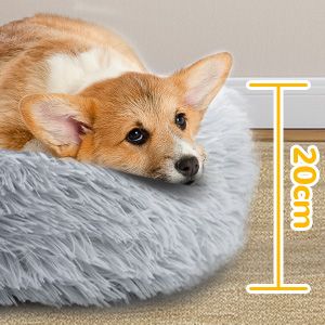 a dog bed with a dog's head resting on it.