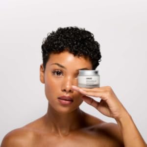 Women holding Revitalize Overnight Mask