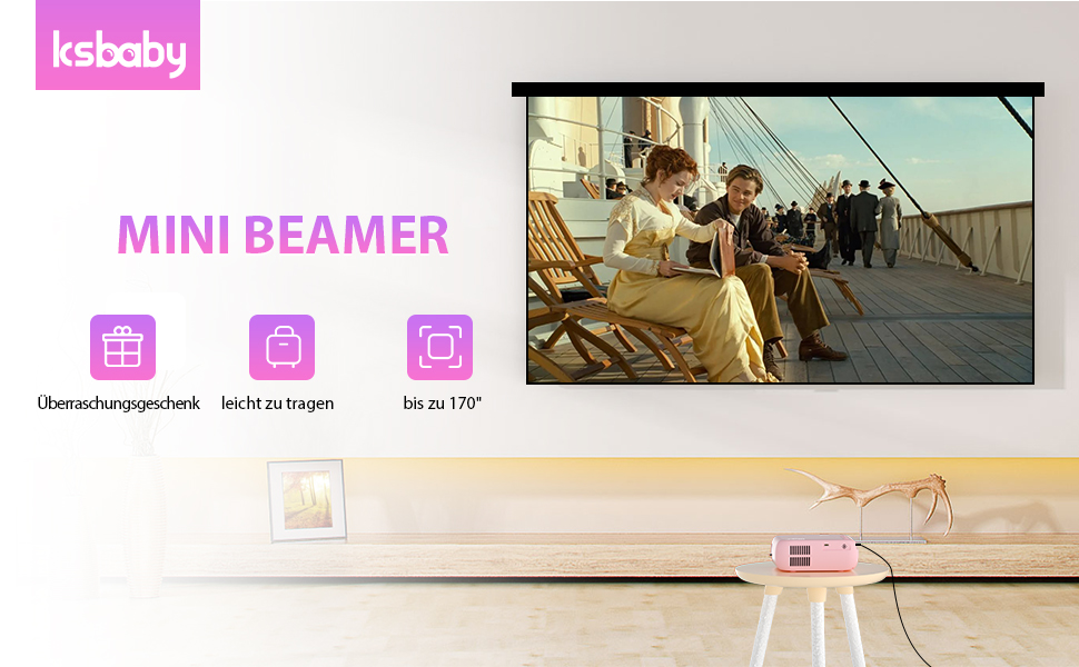 Mini beamer projector displaying a movie scene on a pull-down screen. Product features include USB and HDMI ports, 180-inch projection capability.