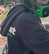 Close-up image of what appears to be dark-colored clothing or uniform material with some reflective or textured elements.