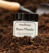 Blaues Wunder Handcreme mit Erde und schaufel im Hintergrund