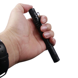 a hand holding a flashlight