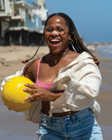 Girl wearing Breezys playing volleyball