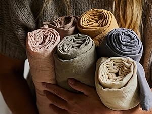 Woman with a handfull of swaddles