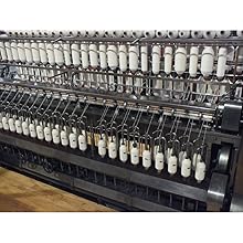 ring spinner twisting textile fibers into yarn