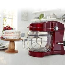 Kenmore Elite Ovation mixer on a white kitchen counter with a cake on a cake stand beside it