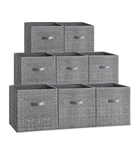 A hand lifting the bottom panel of a storage cube, demonstrating how to fold it flat.