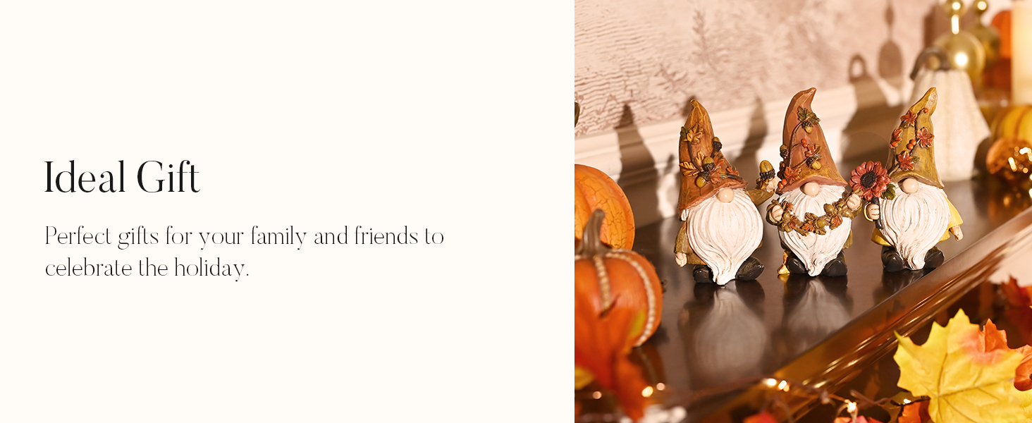 Three decorative gnome figurines with gold pointed hats and white beards, displayed alongside autumn leaves and pumpkins on a wooden surface.