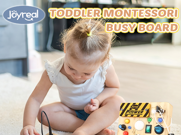 Text reads 'TODDLER MONTESSORI' and 'BUSY BOARD'. Scene showing young child engaged with educational activity board on table surface.