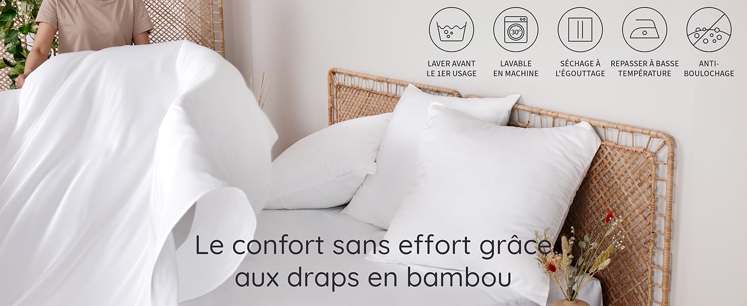 une femme met un drap en bambou sur le lit avec les symboles de lavage dans le coin