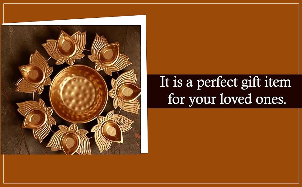 Decorative circular sunburst-style candle holder with metallic golden petals surrounding a textured center dish.