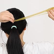 Put your hair into a ponytail and open the hair bun net