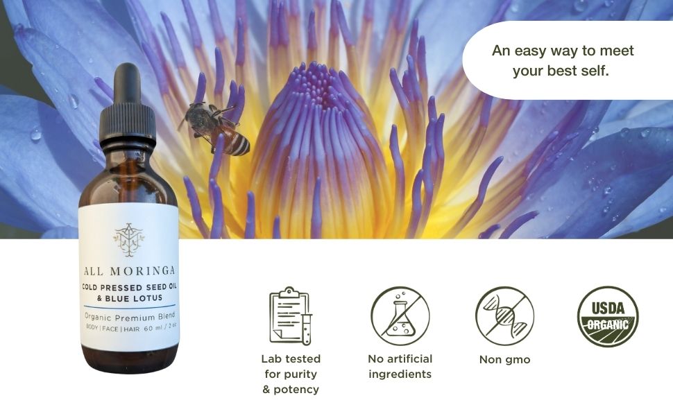 Bottle of organic moring acid oil infused with Blue Lotus. And the flower in the background.