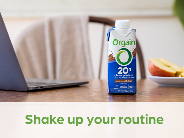 orgain shake next to laptop for working