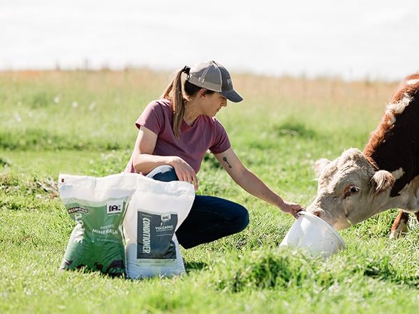 Farmer and child mixing Re-Lyte from ATV while checking on cattle