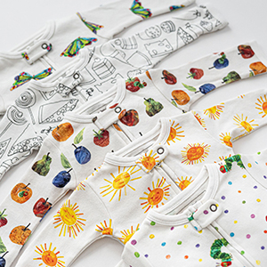 styled flat lay image of zipper footies from very hungry caterpillar collection