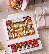 Pâte d'amande Niederegger avec des cadeaux en arrière-plan