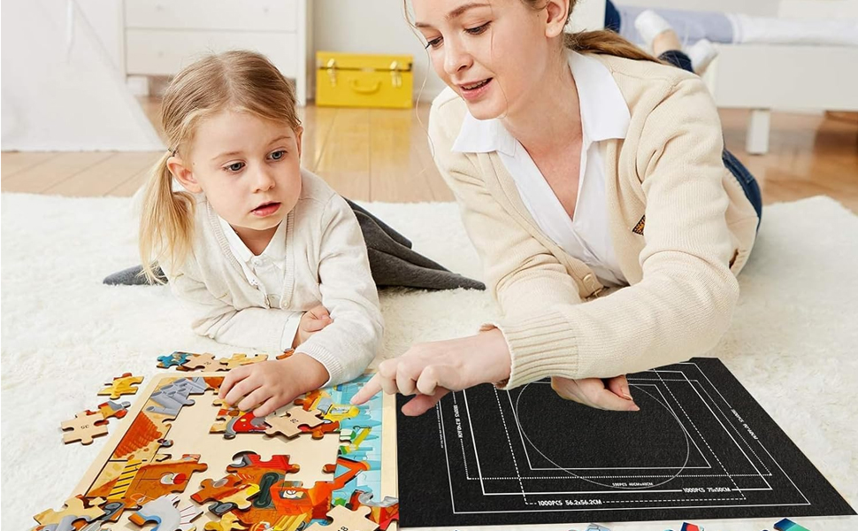 Jigsaw puzzle with colorful animal pieces on a white carpet. An adult and child are working on the puzzle together.