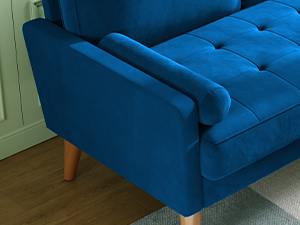 in dark blue velvety fabric with tufted backrest and wooden legs,