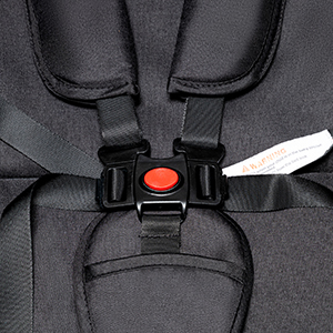 the baby carrier has a red button on the front.