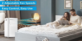 A woman lies on a bed with pillows.