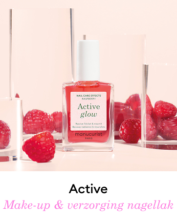 Bottle of Manucurist 'Active glow' nail polish in bright red, surrounded by fresh raspberries. Product labeled as 'Nail care effects' and 'Make-up & verzorging nagellak'.