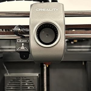 Close-up of 3D printer nozzle extruding filament during printing