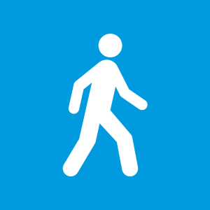 White icon of a person walking on a bright blue background
