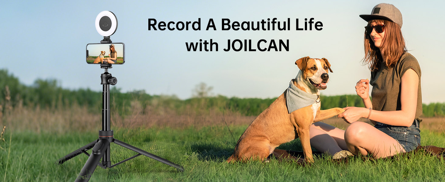 Text reads 'Record A Beautiful Life with JOILCAN'. Photo shows outdoor scene with individual using camera equipment on a mount or stand in grassy field setting.