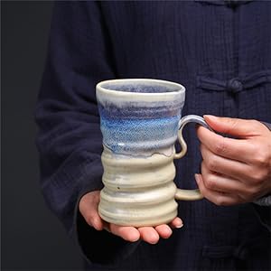 hand ceramic tea mug