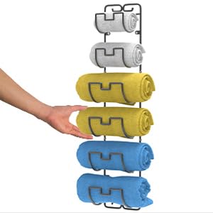 a hand reaching for a towel rack