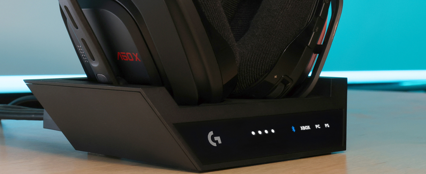 a man playing video games using a50 x lightspeed wireless gaming headset