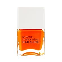 neon orange nail polish with white cap