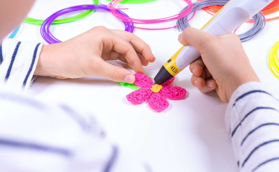 24 Colors 3D Pen Filament. Includes 20 Vibe Colors and 4 Glow in Dark Colors. 10 Feet, 1.75mm Each. PLA Kids Safe Refill 5 Kid making a flower with a 3D pen