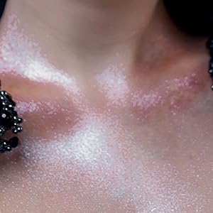 carmela makeup palette being worn as body glitter powder