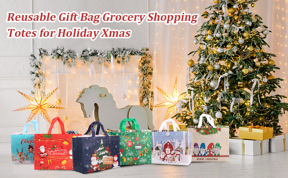 Collection of festive reusable shopping bags with holiday designs displayed in front of decorated Christmas tree and string lights.