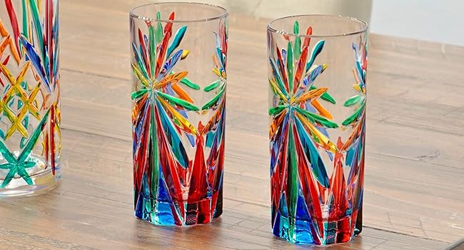 Italian crystal tall drinking glasses on a kitchen dining table set for elegant home decor