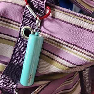 chapie the vacuum insulated keychain attached to a bag