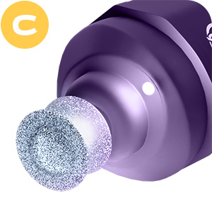 Close-up of a purple cylindrical object with a glittery silver spherical tip. Appears to be a beauty or cosmetic tool.