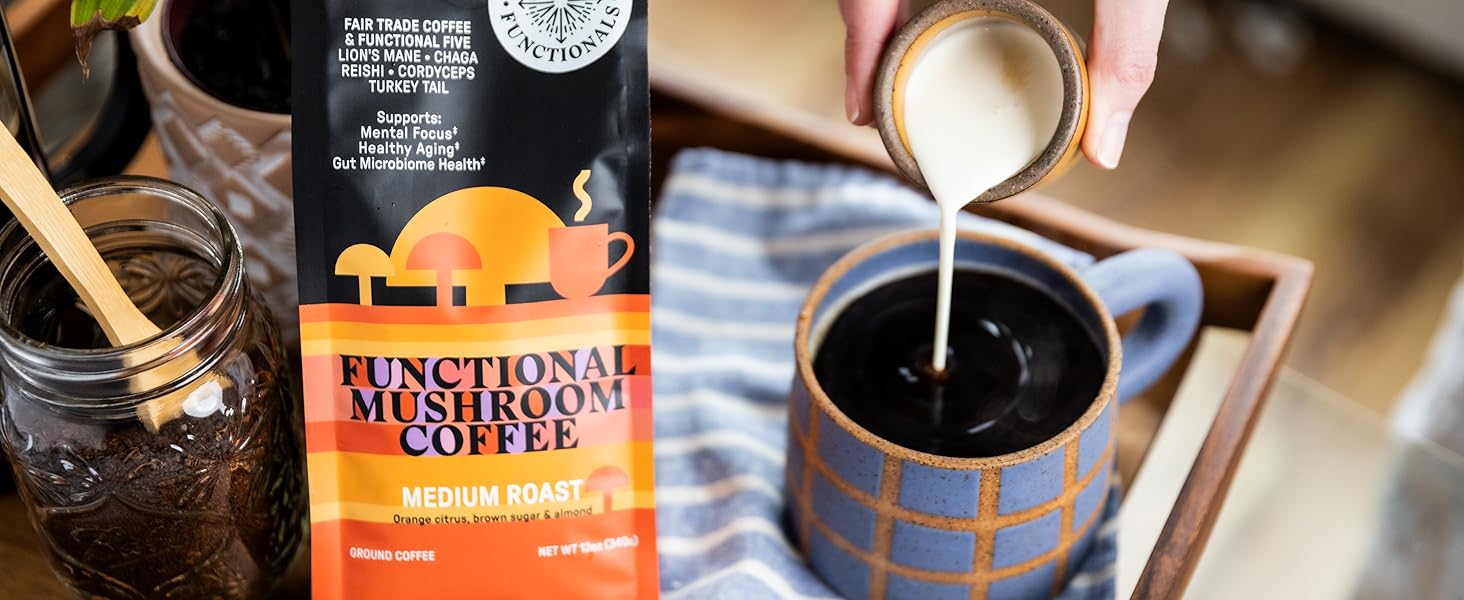 Someone pouring cream into a cup of coffee, next to a bag of coffee
