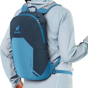 Woman wearing Speed Lite 13 blue pack showing ergonomic fit for full range of motion