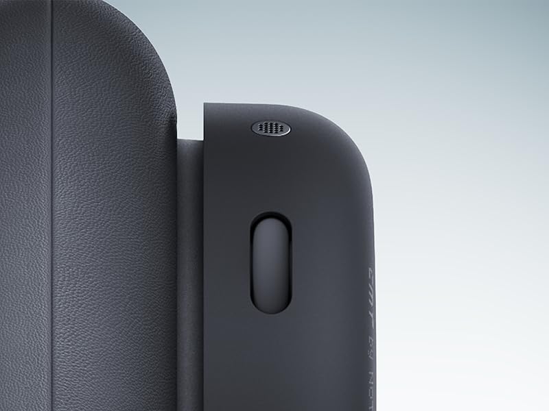 Secuencia de primer plano que muestra detalles de un dispositivo electrónico negro con bordes curvos y un botón o sensor visible en su superficie.