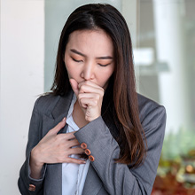 Nature's Jeannie. Man sick at work blowing nose.