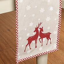 a christmas table runner with a reindeer pattern