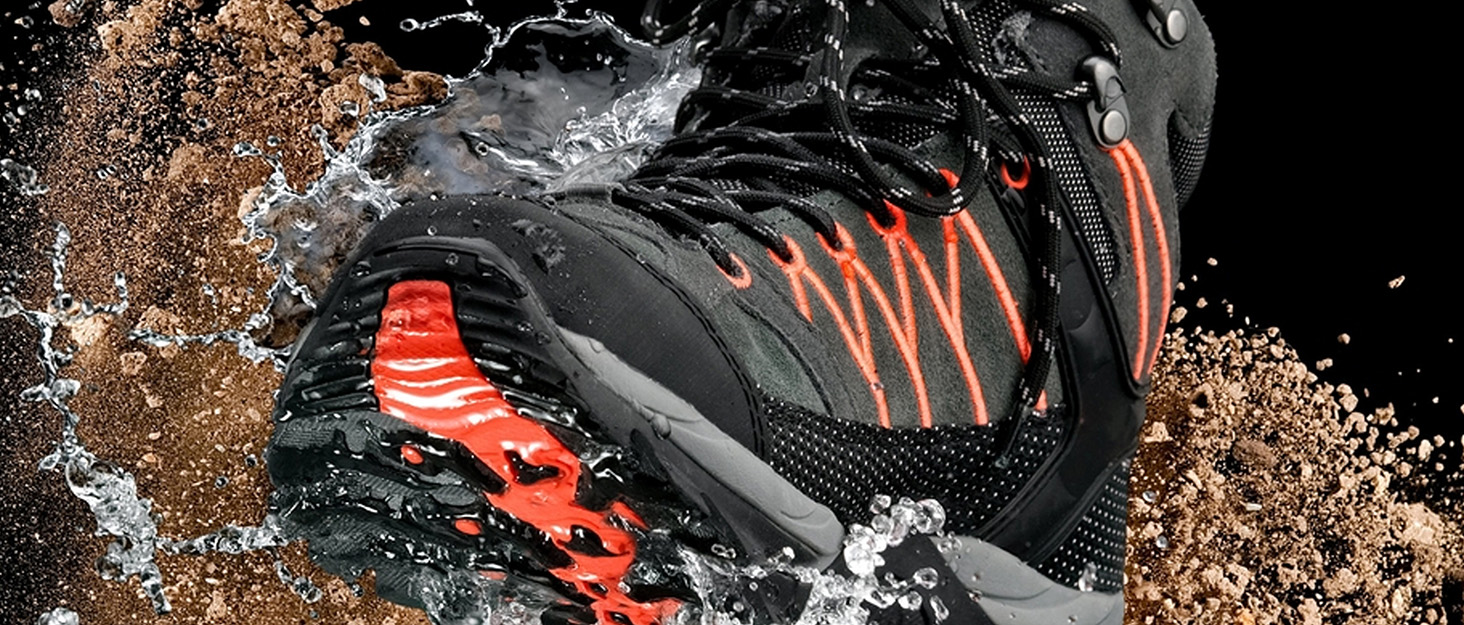 Woman hiking in mountains wearing backpack